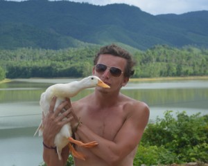 Good-looking Young Ireland Man Travels Vietnam with a Duck